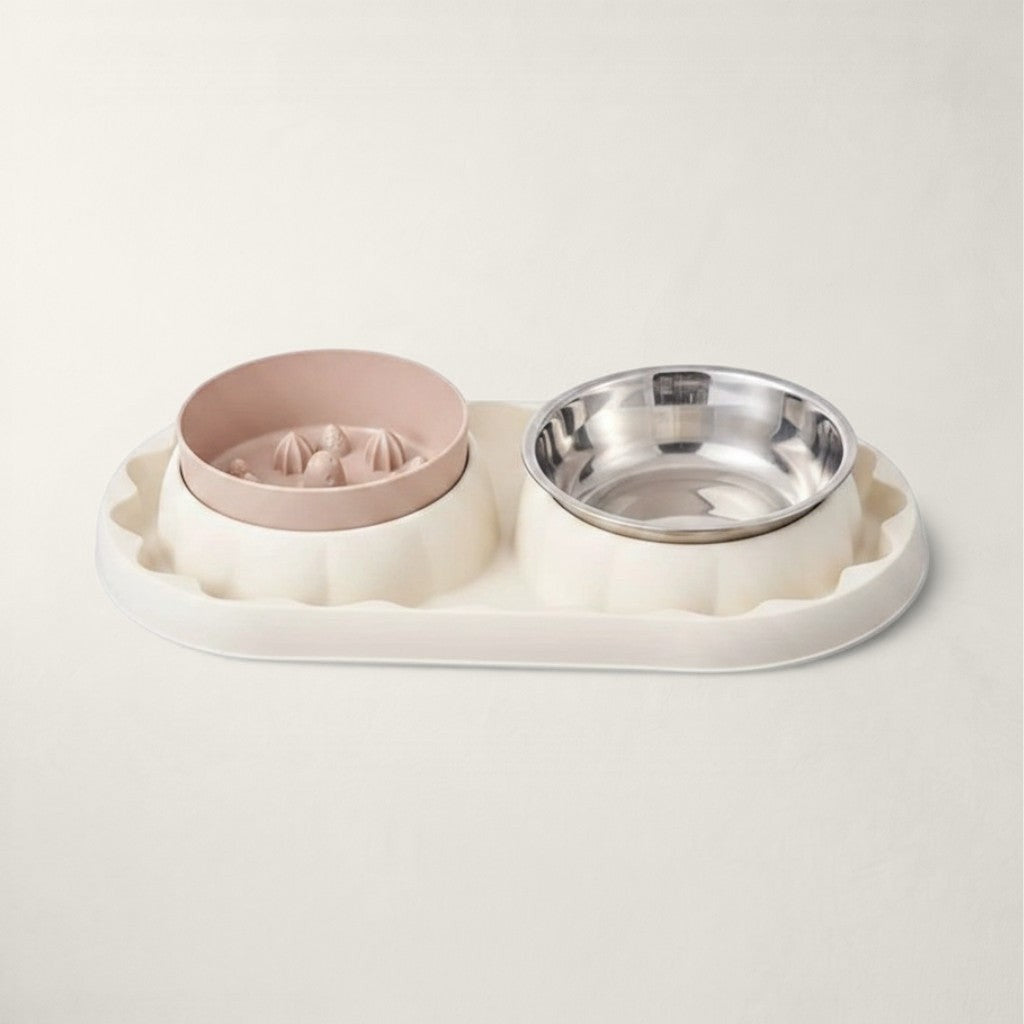 Double gamelle Bofélin rose et blanche avec un bol anti-glouton en inox pour chat.