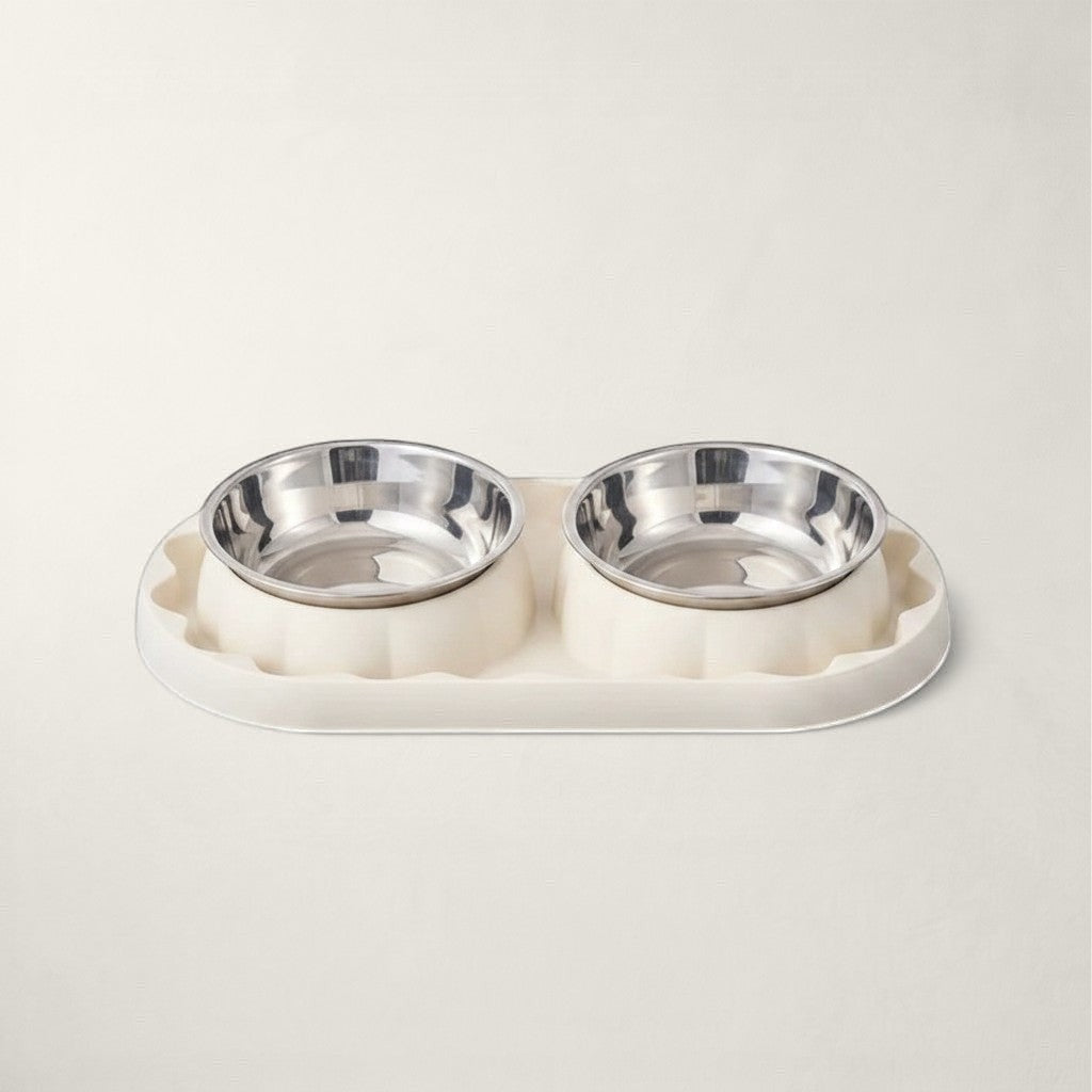 Double gamelle Bofélin avec bols en inox amovibles sur support blanc crème ondulé et plateau ovale antidérapant.