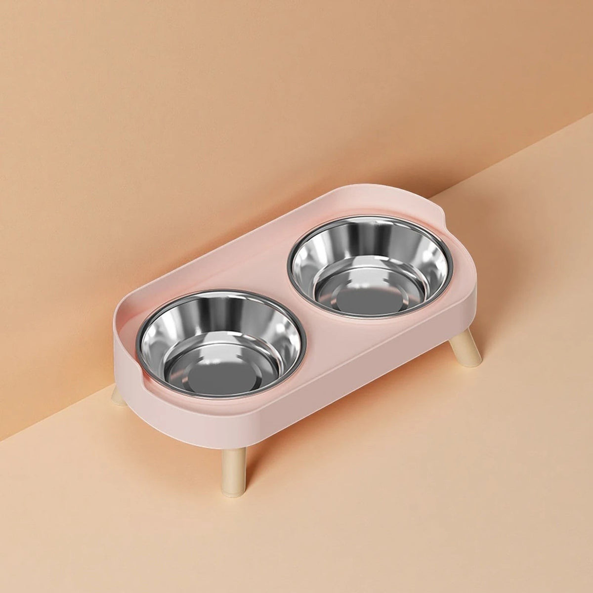 Double gamelle surélevée Bofélin rose clair avec bols en inox amovibles et pieds en bois pour chat