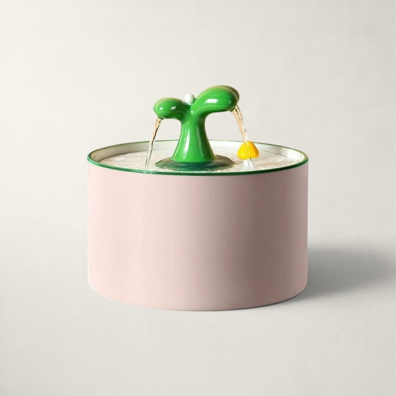 Fontaine à eau Bofélin en céramique rose avec bec verseur vert en forme de plante pour chat