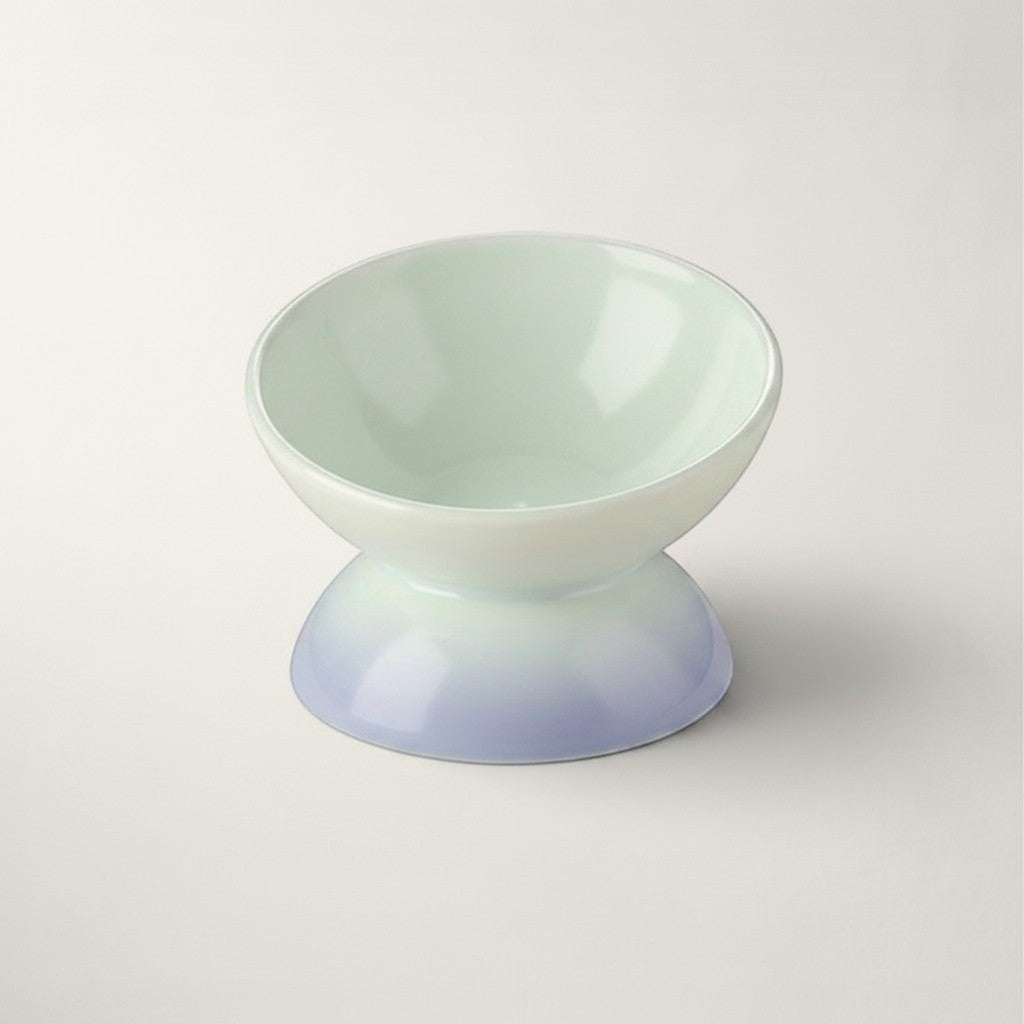 Gamelle surélevée Bofélin en céramique émaillée vert pastel et violet pour le confort cervical du chat