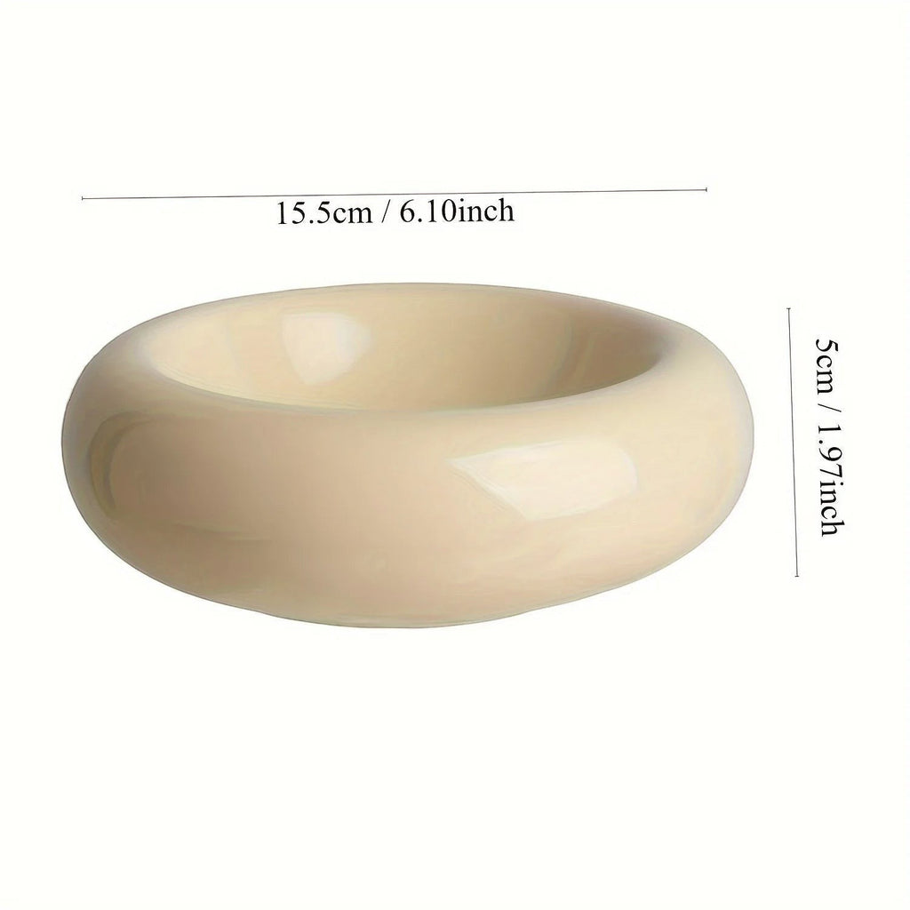 Gamelle pour chat Bofélin en céramique émaillée beige en forme de donut, ergonomique et anti-fatigue des moustaches.