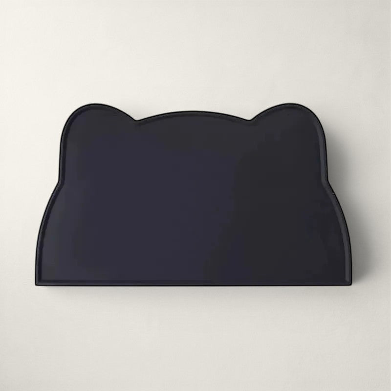 Tapis de gamelle Bofélin en silicone noir en forme de tête de chat avec bords anti-débordement pour protéger le sol.