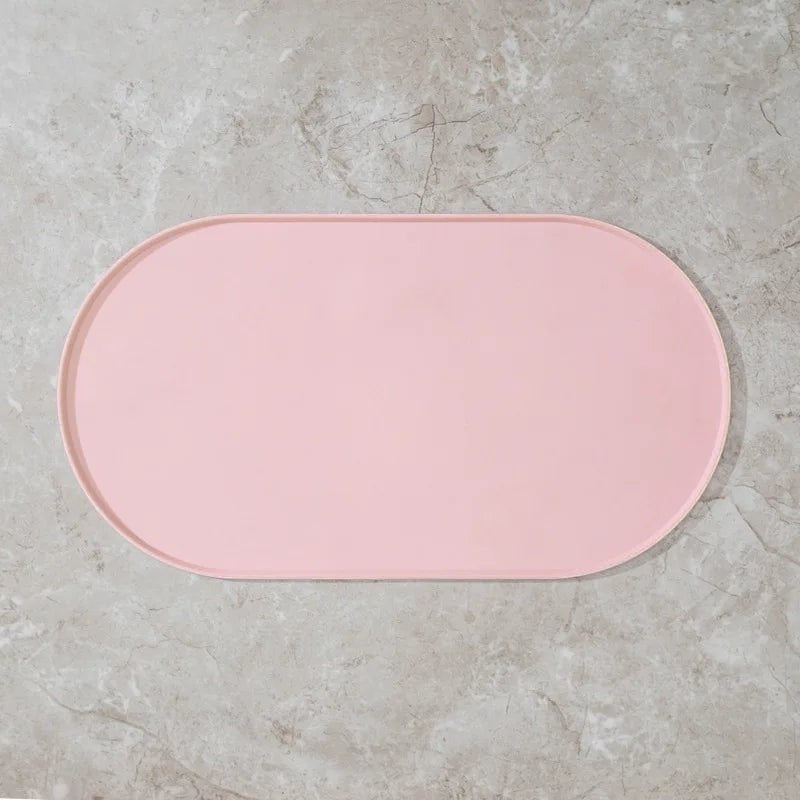 Tapis de gamelle Bofélin ovale en silicone rose avec bords relevés anti-débordement pour protéger le sol